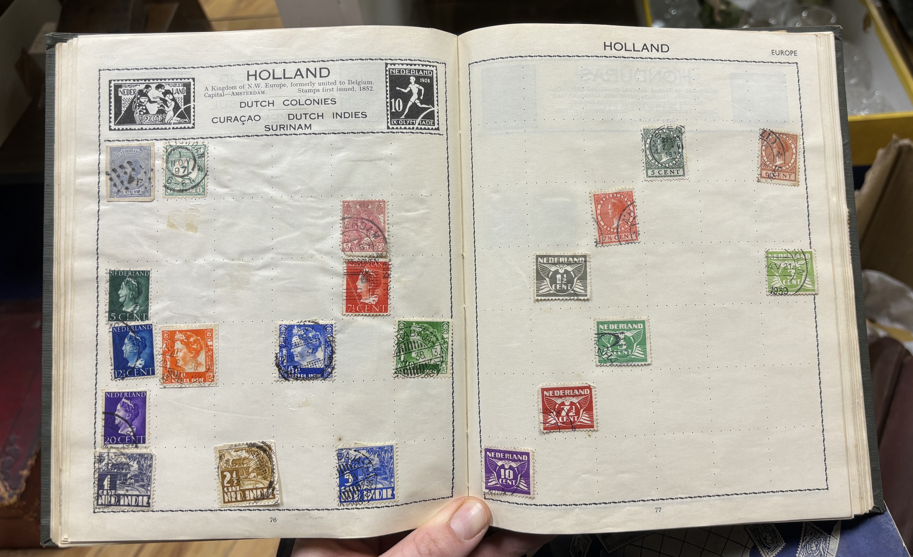 The Imperial Postage Stamp Album in three volumes, containing a stamp collection which includes some early stamps from Great Britain and the Empire, a Penny Black, early penny reds, and twopenny blues, etc. together with